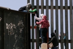 punjabis Crossing Border Fence, punjabi women, video clip shows punjabi women children crossing border fence into u s, Mexico border